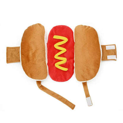 Small dog in a cozy hot dog bun costume ready for a winter walk
